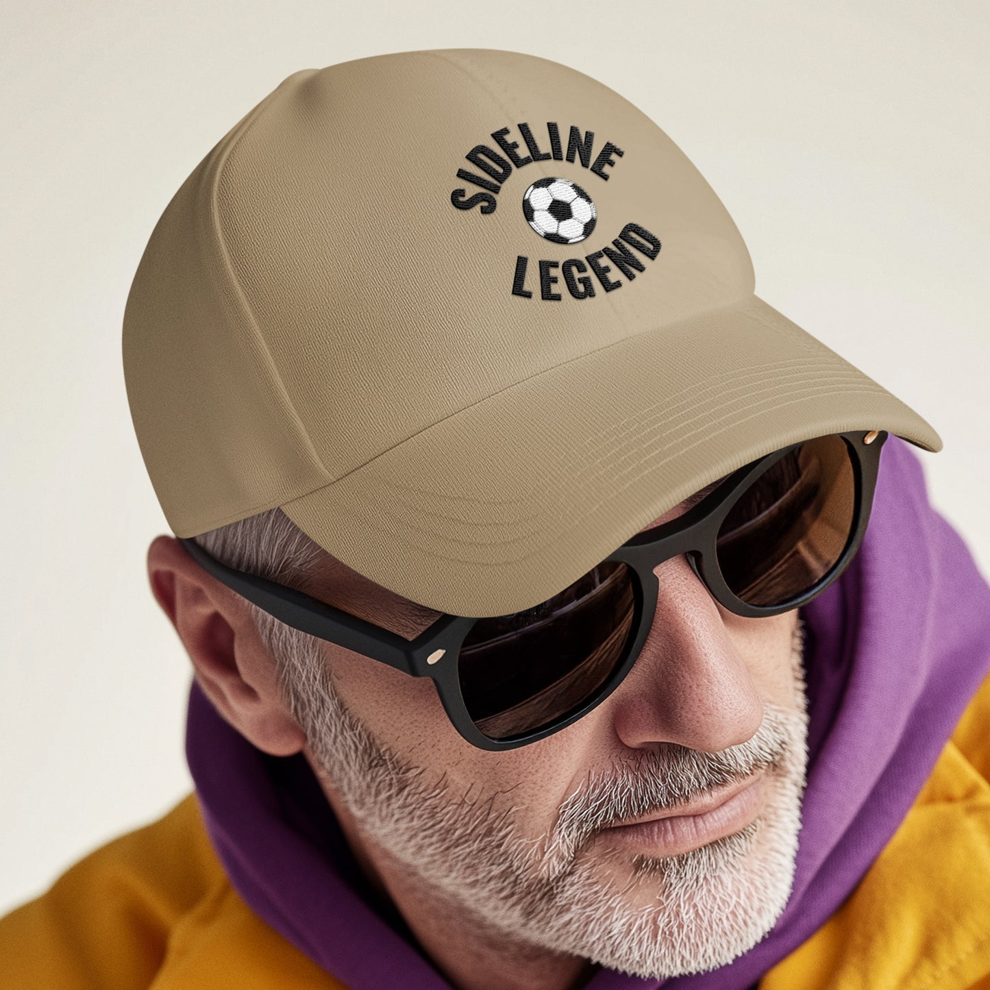 Soccer Dad wearing 'sideline Legend' Cap, watching game from the sideline